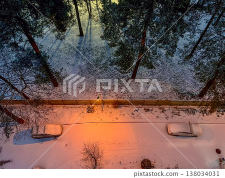 Aerial view of snow covered park and street at winter twilight. High quality photo 138034031