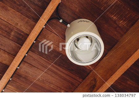 Ceiling lamp, Downlight mounted at wooden ceiling roof at home interior electricity modern design. 138034797