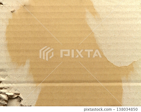 Cardboard background texture with a torn surface 138034850