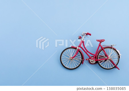 World Bicycle Day. Bicycle isolated on sky blue background. Copy space. Environment preserve. World Bicycle Day. Bicycle isolated on sky blue background. Copy space. Environment preserve. 138035085