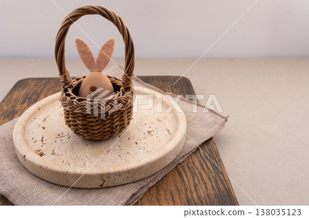 Easter eggs decorated with natural materials, travertine plate and background. 138035123