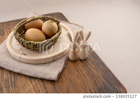 Easter eggs decorated with natural materials, travertine plate and background. Easter eggs decorated with natural materials, travertine plate and background. 138035127
