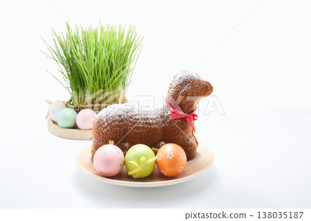 Easter lamb cake with decorative eggs and green grass Easter lamb cake with decorative eggs and green grass 138035187