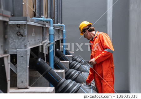 Professional plumbing pipe, Water cooling system engineer man working check large water pipeline. 138035333