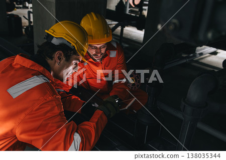 Two professional engineer male teamwork service maintenance, Worker industry water pipe tube system Two professional engineer male teamwork service maintenance, Worker industry water pipe tube system 138035344