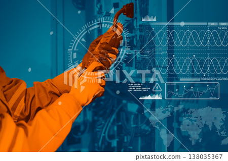 Electrician engineer worker testing electric cable at main power line cabinet fuse box. Electrician engineer worker testing electric cable at main power line cabinet fuse box. 138035367