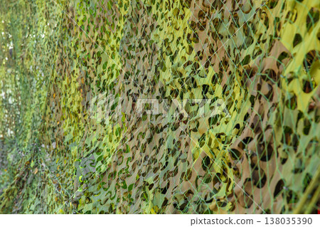 Military camouflage cover curtain. Military army hiding tactical canvas pattern for background. 138035390
