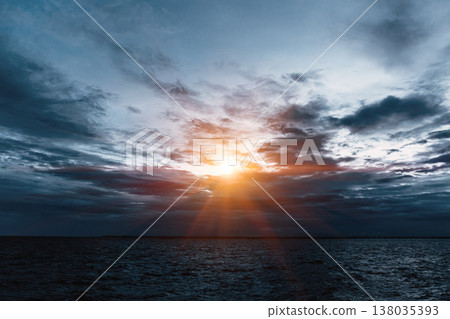 Dark sea black sky cloudy with a bright light sun for last hope, new hope concept. Dark sea black sky cloudy with a bright light sun for last hope, new hope concept. 138035393