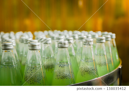 Drink factory production line fruit juice beverage product at conveyor belt. Drink factory production line fruit juice beverage product at conveyor belt. 138035412