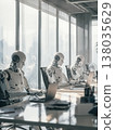 Futuristic robots working collaboratively in a modern office environment with advanced technology 138035629