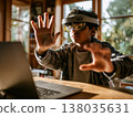 Indian teenage student engaging with virtual reality technology at a desk with immersive learning experience 138035631