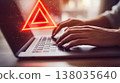 Hands typing on laptop with glowing red triangle symbolizing technology and innovation 138035640