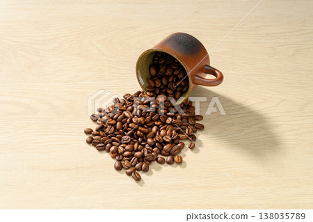 Coffee beans on a wood grain background Coffee beans on a wood grain background 138035789