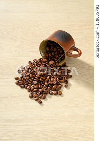Coffee beans on a wood grain background 138035793