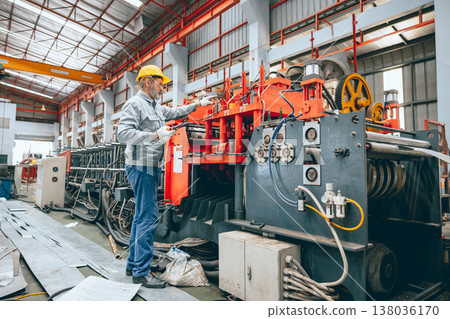 Professional senior Industrial worker in protective helmet and uniform service machinery in factory 138036170