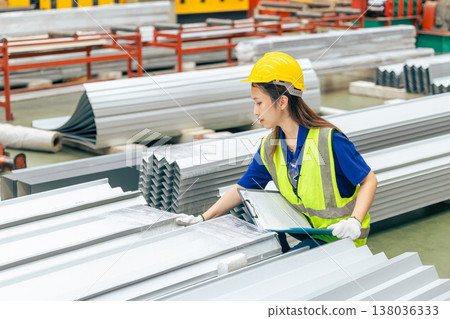 Young Asian woman engineer worker, professional employee working in metal sheet plant factory Young Asian woman engineer worker, professional employee working in metal sheet plant factory 138036333