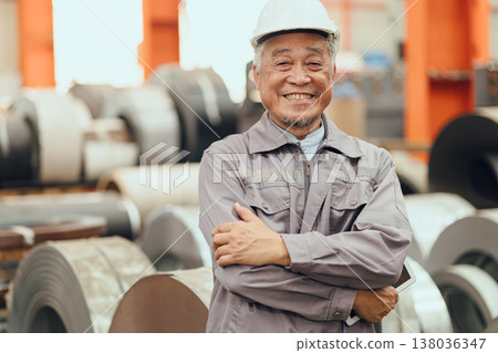 Senior Asian engineer man worker happy smiling professional working in heavy industry plant factory 138036347