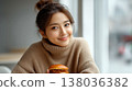 Smiling asian woman holding burger sitting in cozy cafe enjoying casual meal and relaxed lifestyle moment 138036382