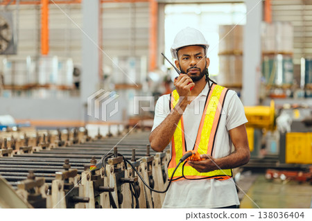 Professional African black worker working machine operator in heavy industry factory supervisor 138036404