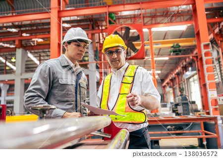 Professional senior engineer training, Supervisor work with young engineer in factory plant. Professional senior engineer training, Supervisor work with young engineer in factory plant. 138036572