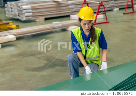 Asian woman engineer worker, professional employee working in metal sheet plant factory 138036573