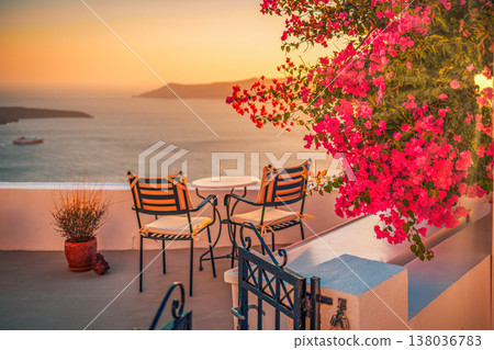 Romantic sunset in Santorini with chairs, flowers, honeymoon couple, scenic anniversary travel and love vacation background Romantic sunset in Santorini with chairs, flowers, honeymoon couple, scenic anniversary travel and love vacation background 138036783