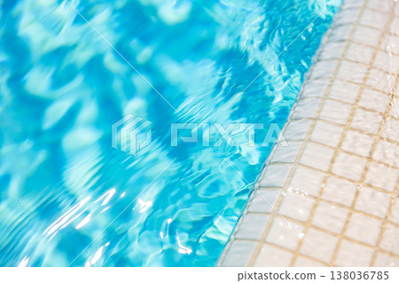 Top-down abstract swimming pool with white tiles, sunshine reflections, fun recreation and relaxation, outdoor vacation design background Top-down abstract swimming pool with white tiles, sunshine reflections, fun recreation and relaxation, outdoor vacation design background 138036785