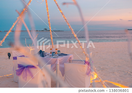 Sunset romantic beach dinner, vibrant colorful sky, ocean view, dreamy tropical vacation, couple getaway Sunset romantic beach dinner, vibrant colorful sky, ocean view, dreamy tropical vacation, couple getaway 138036801
