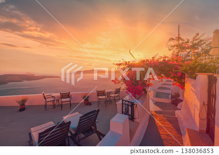 Romantic sunset Santorini Greece caldera, sun beds with flowers, honeymoon couple love scene, idyllic Mediterranean travel background Romantic sunset Santorini Greece caldera, sun beds with flowers, honeymoon couple love scene, idyllic Mediterranean travel background 138036853