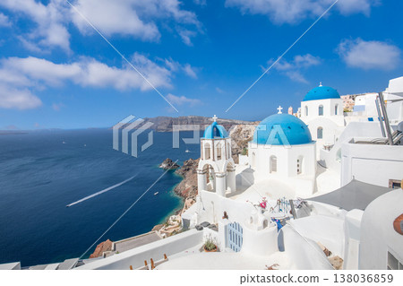 Oia Santorini Greece sunny landscape, vibrant blue domes, pristine white architecture, idyllic Mediterranean holiday scene 138036859