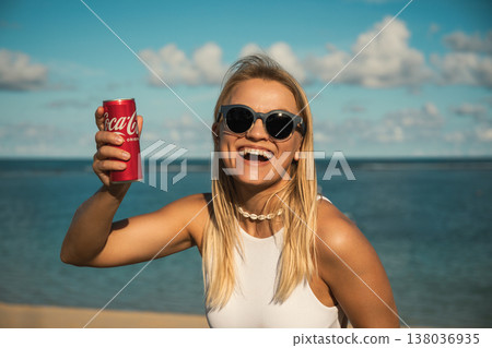 Bali, Indonesia, March 18, 2026: Coca-Cola drink at the beach Bali, Indonesia, March 18, 2026: Coca-Cola drink at the beach 138036935