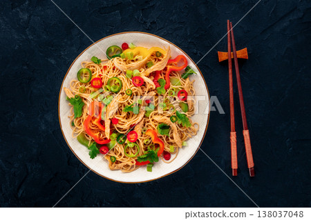 Chow Mein noodles with chicken and vegetables, overhead flat lay shot Chow Mein noodles with chicken and vegetables, overhead flat lay shot 138037048