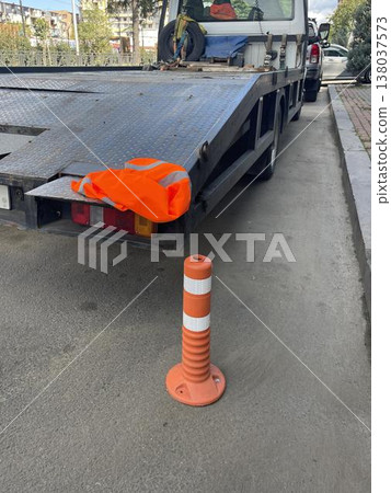 Special vehicles are on the road waiting for cars to be towed away. 138037573