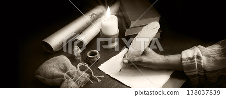 Man writing a letter on a desk 138037839