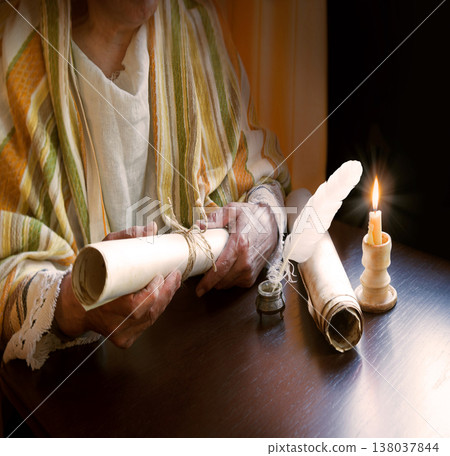 Man holding an old scroll 138037844