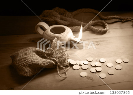 A loop made from old thick rope and coins A loop made from old thick rope and coins 138037865