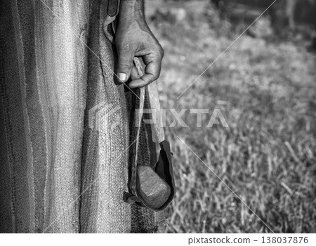 Ancient man with a sling 138037876