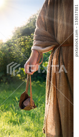 Man's hand with an old sling Man's hand with an old sling 138037881