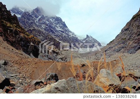 Chalaadi Glacier, ice, glacial flour, moraine, and snow in the Caucasus Mountains. Mestia, Svaneti, Georgia. 138038268