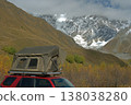 A car camping tent on the roof of an SUV in the mountains in autumn 138038280