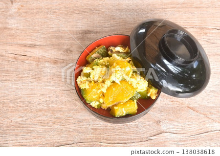 stir fried pumpkin mixed with egg vegetarian food on bowl with lid stir fried pumpkin mixed with egg vegetarian food on bowl with lid 138038618