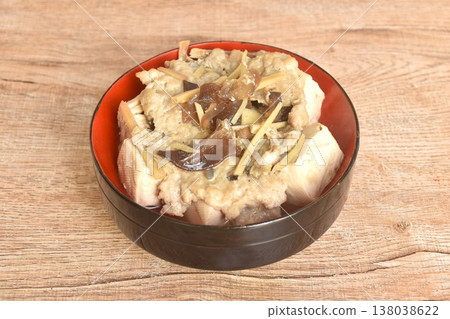 steamed white tofu stuffed mashed pork with black ear mushroom and slice ginger in soy sauce on bowl 138038622