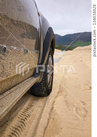 Car parked on street after off-road in Tarifa, Spain. 138038828