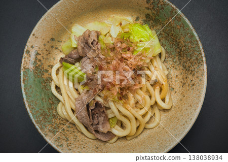 Our family's go-to dish: stir-fried udon noodles, seasoned with soy sauce and topped with bonito flakes. Our family's go-to dish: stir-fried udon noodles, seasoned with soy sauce and topped with bonito flakes. 138038934
