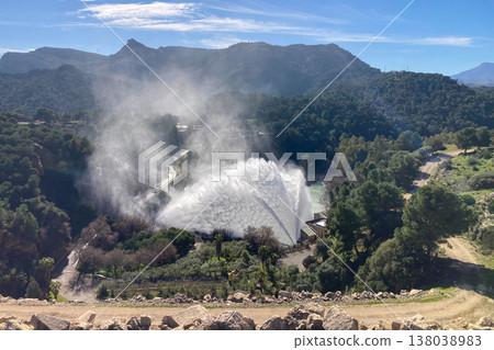 Dramatic emergency water release cascading from Guadalhorce reservoir after heavy rains creating powerful natural scenery in Spain. Dramatic emergency water release cascading from Guadalhorce reservoir after heavy rains creating powerful natural scenery in Spain. 138038983