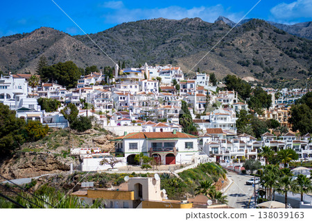 Wonderful landscapes of the shimmering sea and charming city unfold, offering breathtaking coastal views and a picturesque atmosphere in Nerja, Spain Wonderful landscapes of the shimmering sea and charming city unfold, offering breathtaking coastal views and a picturesque atmosphere in Nerja, Spain 138039163