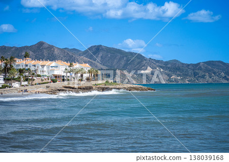 Wonderful landscapes of the shimmering sea and charming city unfold, offering breathtaking coastal views and a picturesque atmosphere in Nerja, Spain Wonderful landscapes of the shimmering sea and charming city unfold, offering breathtaking coastal views and a picturesque atmosphere in Nerja, Spain 138039168