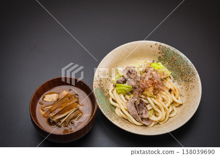 Our family's go-to dish: stir-fried udon noodles, seasoned with soy sauce and topped with bonito flakes. Our family's go-to dish: stir-fried udon noodles, seasoned with soy sauce and topped with bonito flakes. 138039690