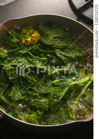 Boil edible rape blossoms in a pot Boil edible rape blossoms in a pot 138039720