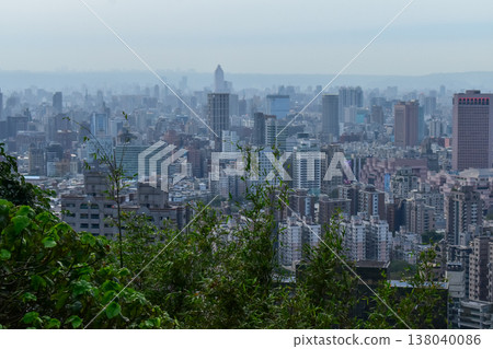 Aerial view of skyline of Taipei city at sunset from Xiangshan Elephant Mountain with colorful sky. Beautiful landscape and cityscape of Taipei downtown buildings and architecture in the city 138040086
